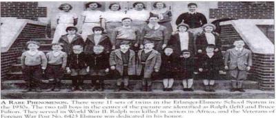 Black and white photo of 11 twins in the 1930s